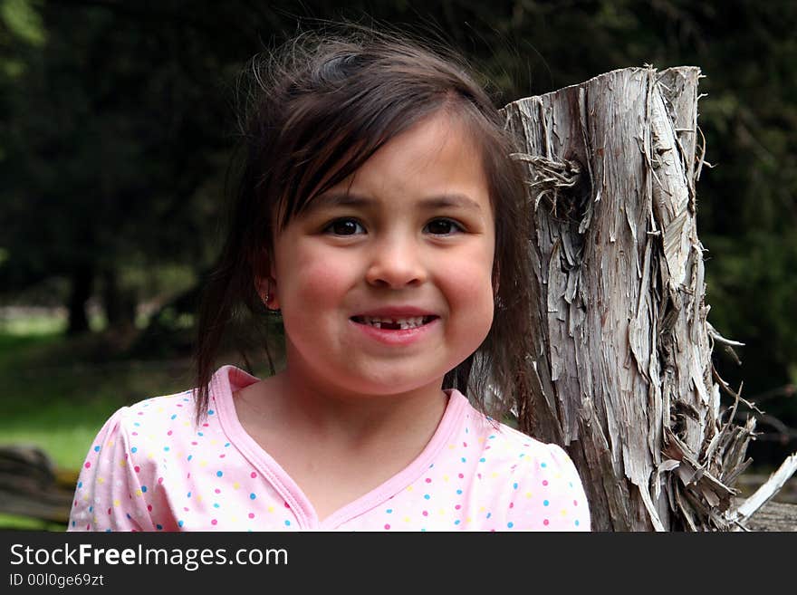 Smiling girl with missing teeth