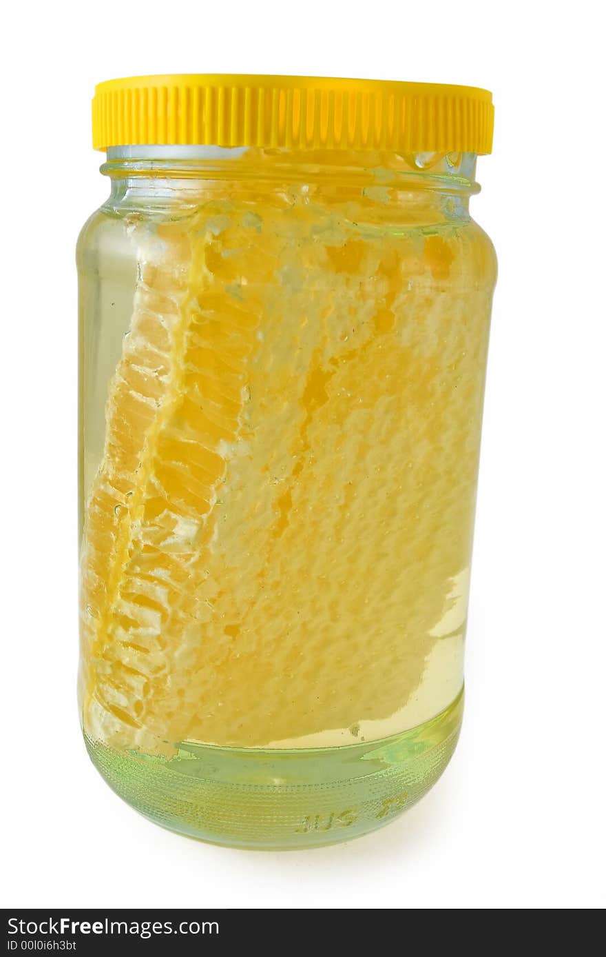 A chunk of acacia honeycomb in clear acacia honey. A chunk of acacia honeycomb in clear acacia honey.