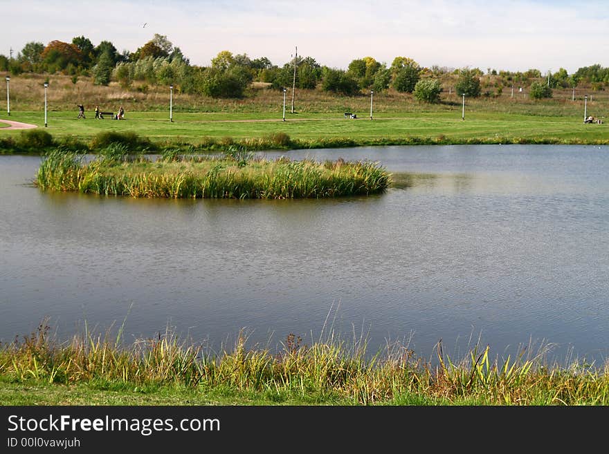 City rest... island on the pond, grass, rural landscape,. City rest... island on the pond, grass, rural landscape,