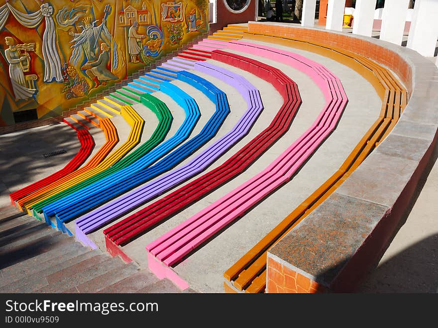 Rainbow colored benches at childpark