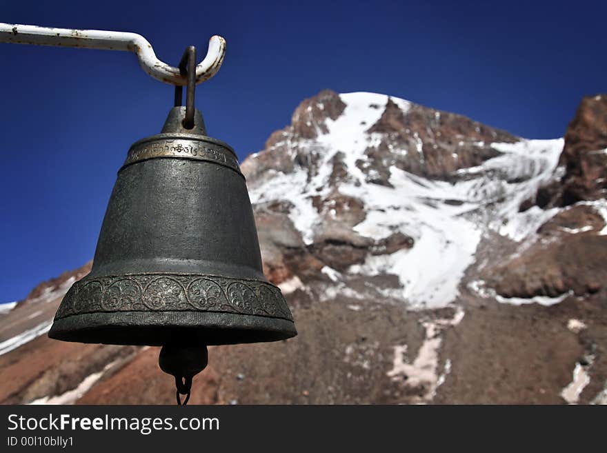 Old bell with a mountain.