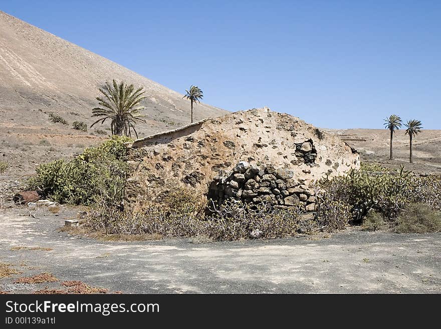 Rustic house in an arid landscape in Lanzarote, Canary Islands, Spain. Rustic house in an arid landscape in Lanzarote, Canary Islands, Spain