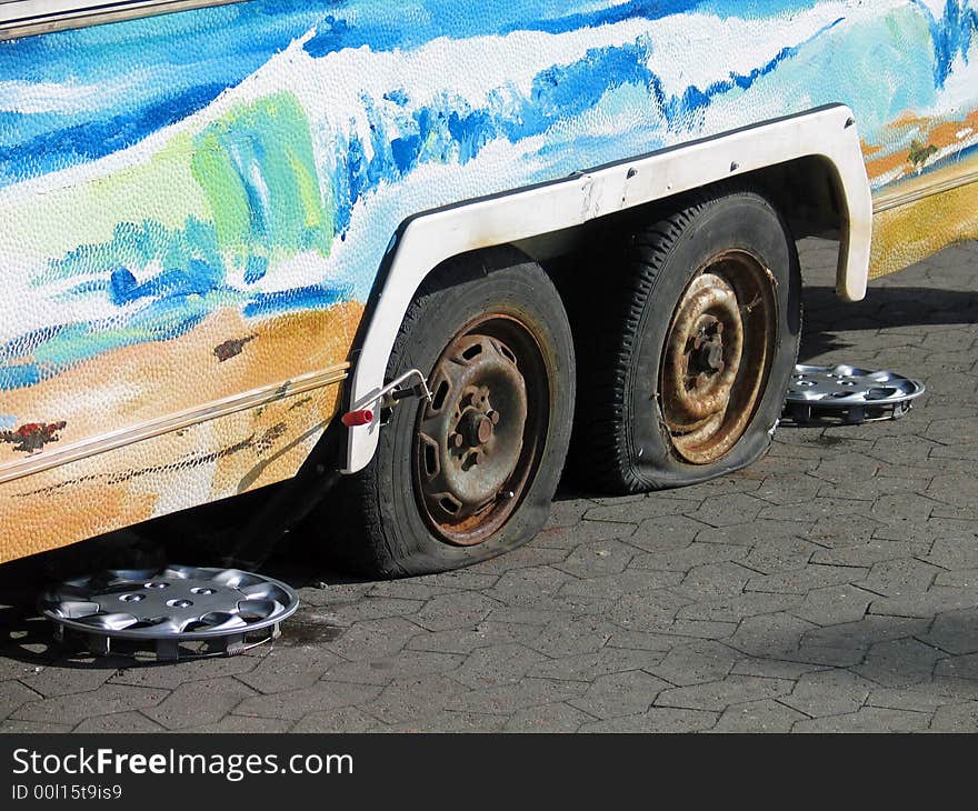 Two punctured flat tires of a car