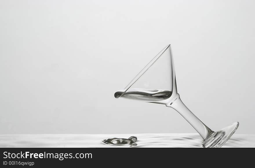 White glass pouring mercury, describing the uniqueness of purity