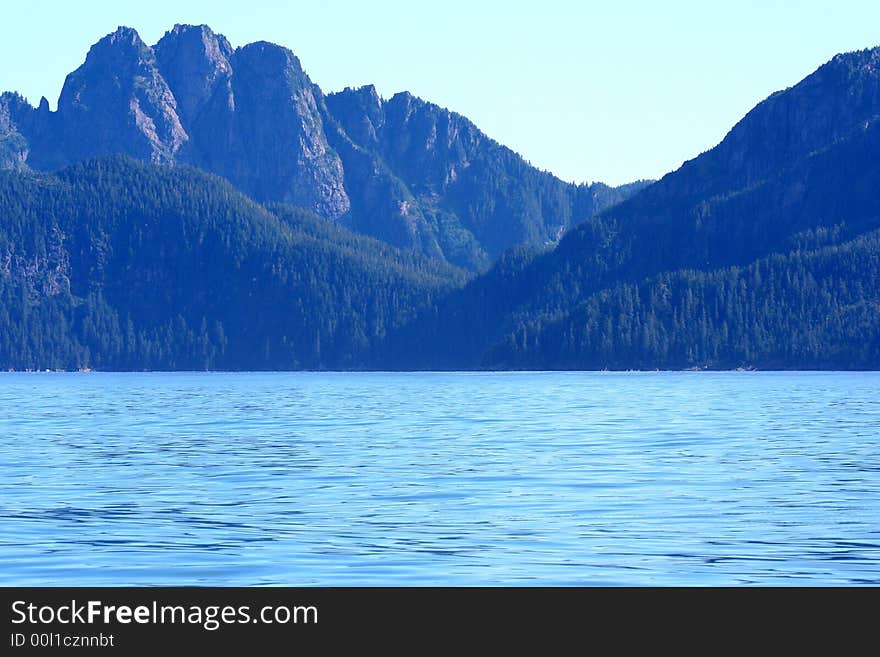 Alaska shorline with snow-covered mountains in background. Alaska shorline with snow-covered mountains in background.