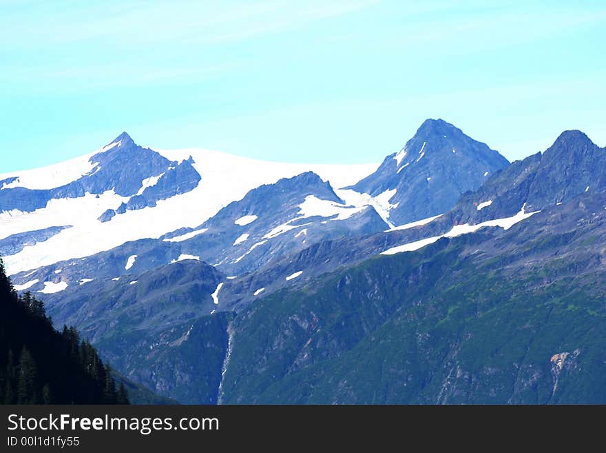 Harsh peaks covered with snow in Alaska. Harsh peaks covered with snow in Alaska