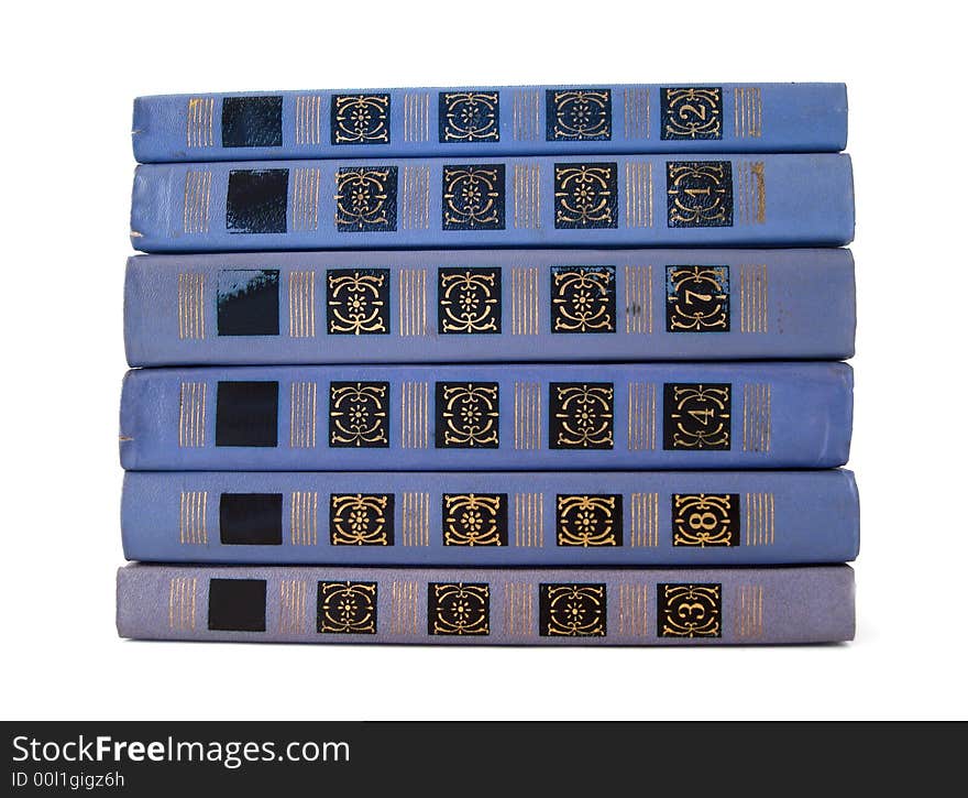 Stack of violet books over white background