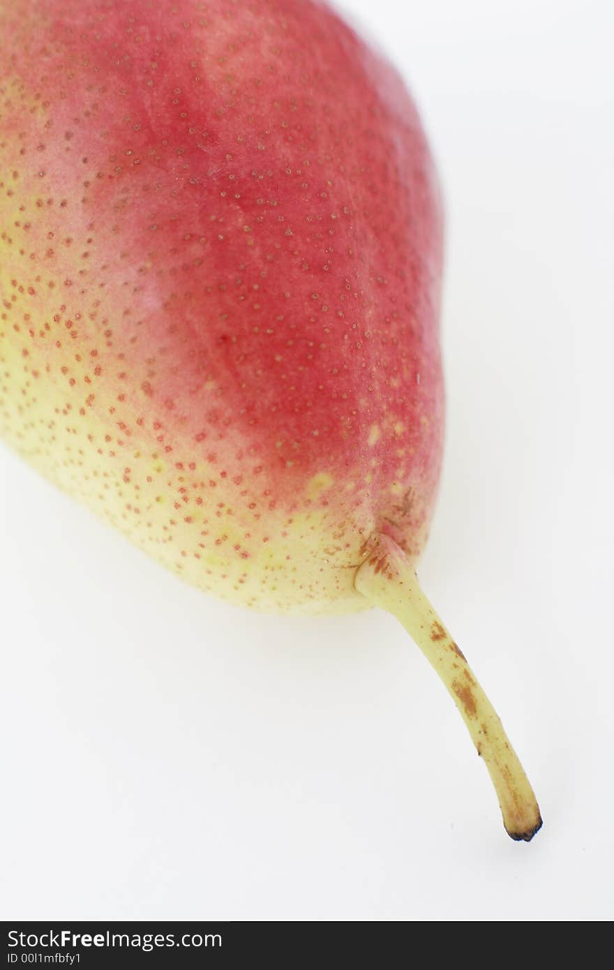 A ripe English pear against a white background. A ripe English pear against a white background