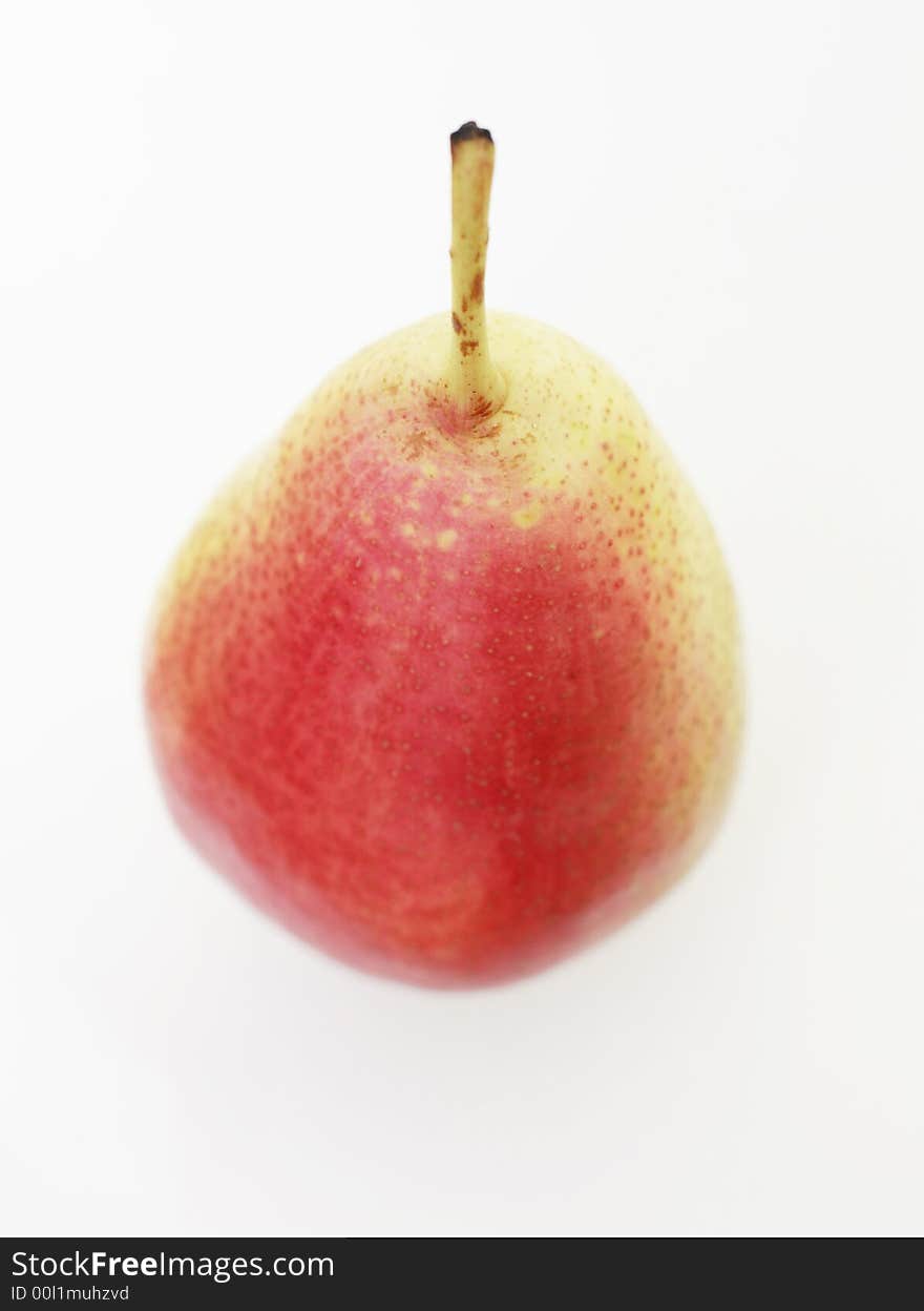 A single ripe English pear against a white background. A single ripe English pear against a white background