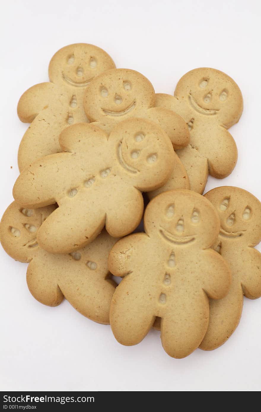 A pile of Gingerbread men against a white background