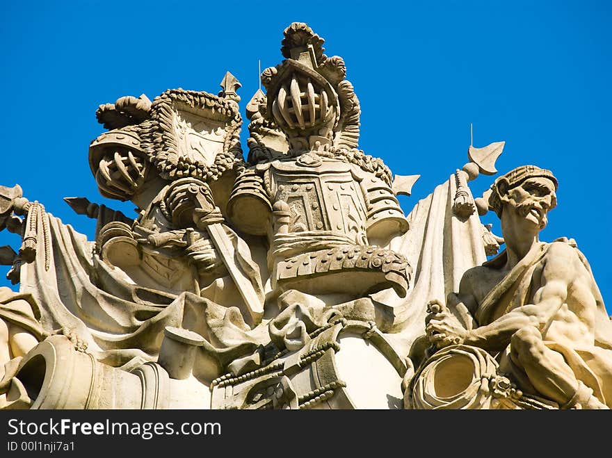 Cream-White stucco sculptures in front of deeply blue sky