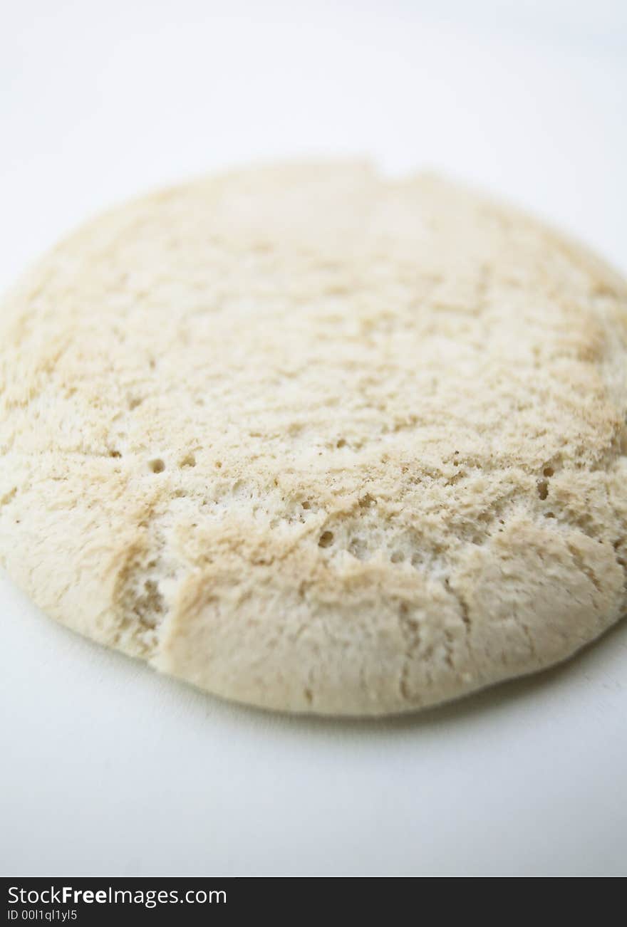 A single Baby rusk biscuit against white background