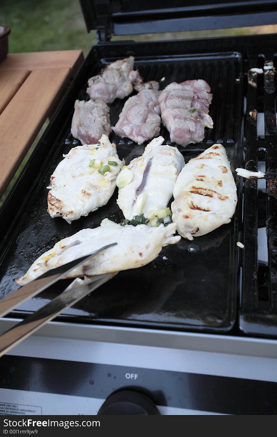 Cooking meat on a BBQ. Cooking meat on a BBQ