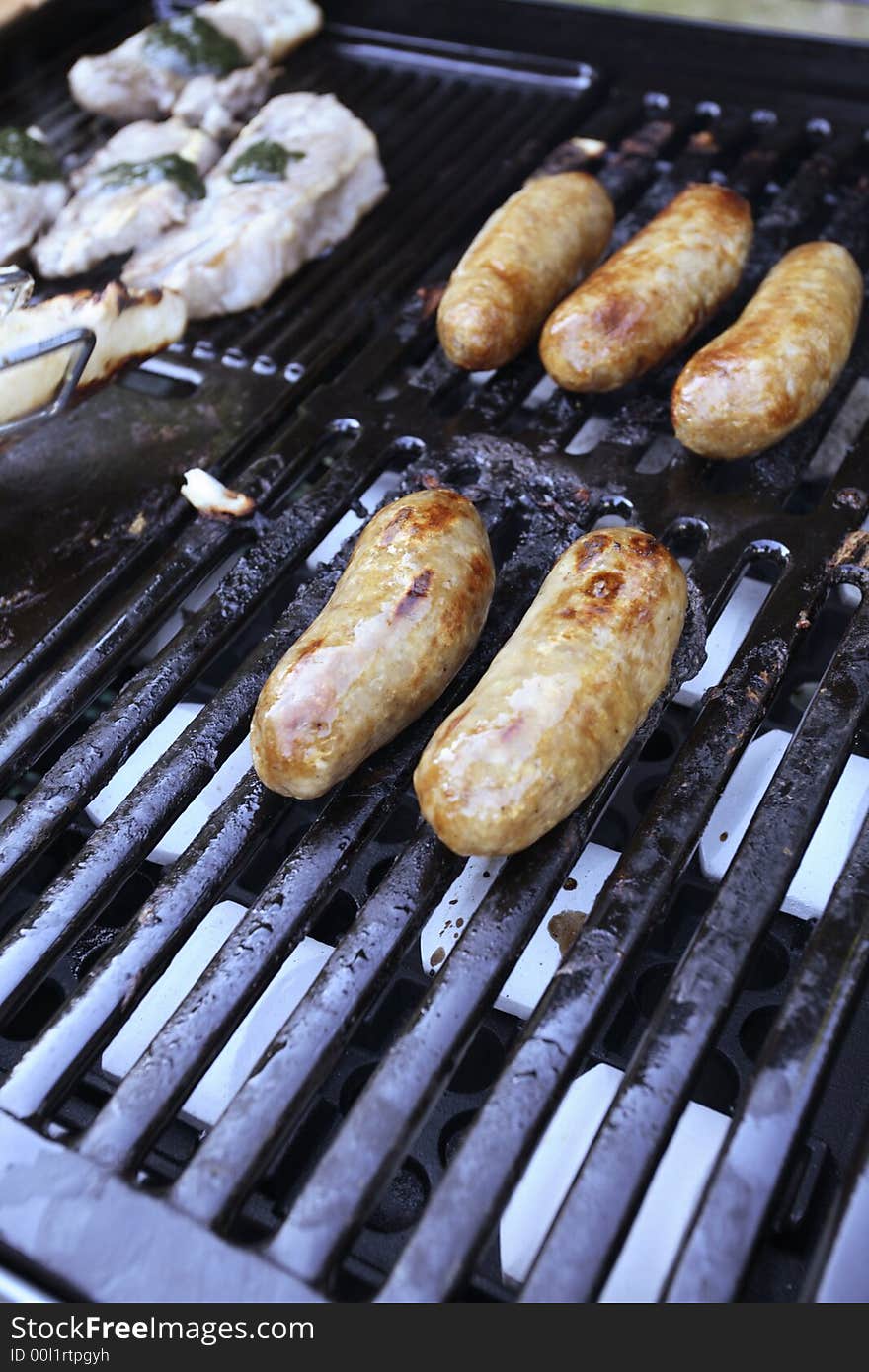 Cooking meat sausages on a BBQ. Cooking meat sausages on a BBQ