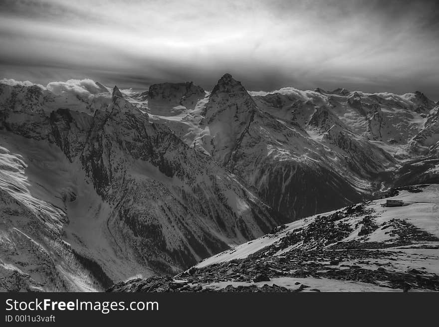 Winter austere rocks and clouds