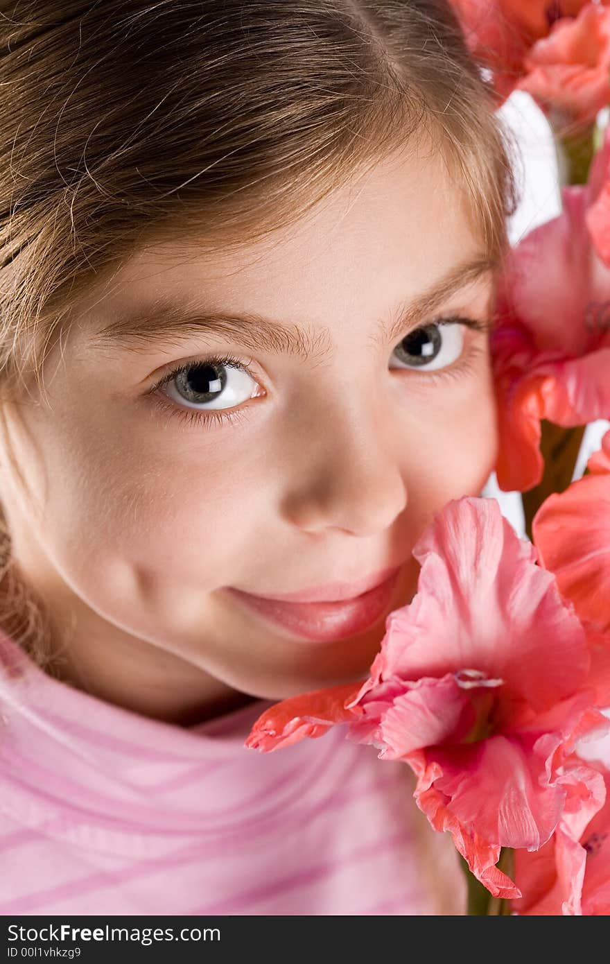 The girl touches a gentle flower. The girl touches a gentle flower