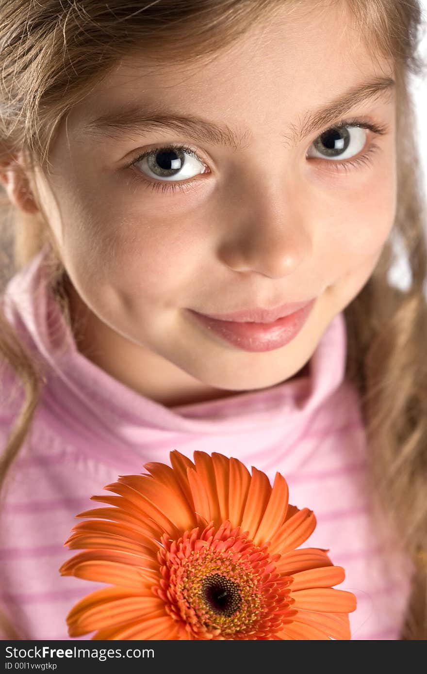 The girl touches a gentle flower. The girl touches a gentle flower