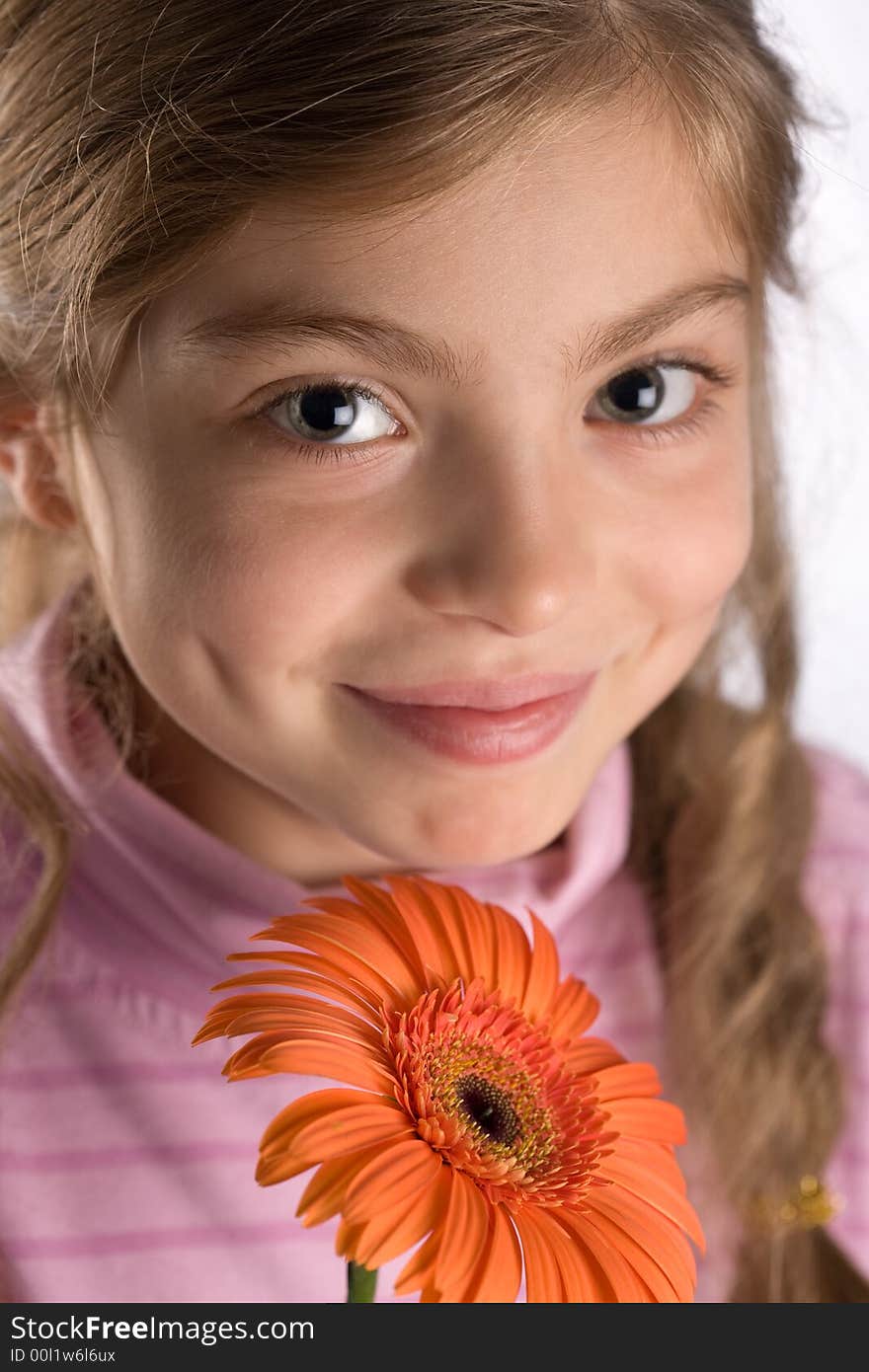 The girl touches a gentle flower. The girl touches a gentle flower