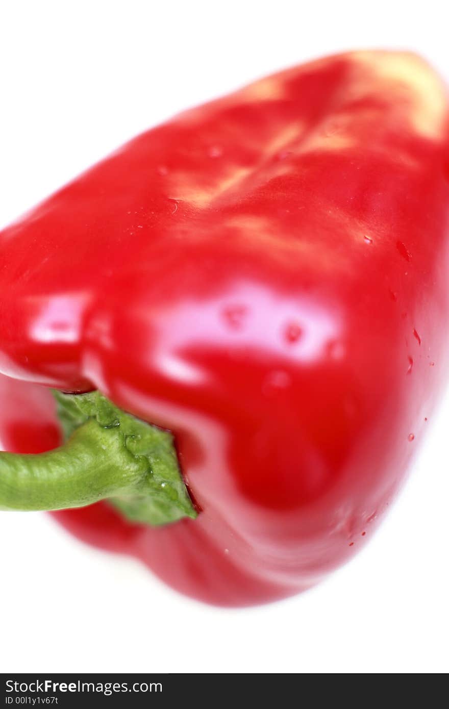 A single Red pepper against a white background