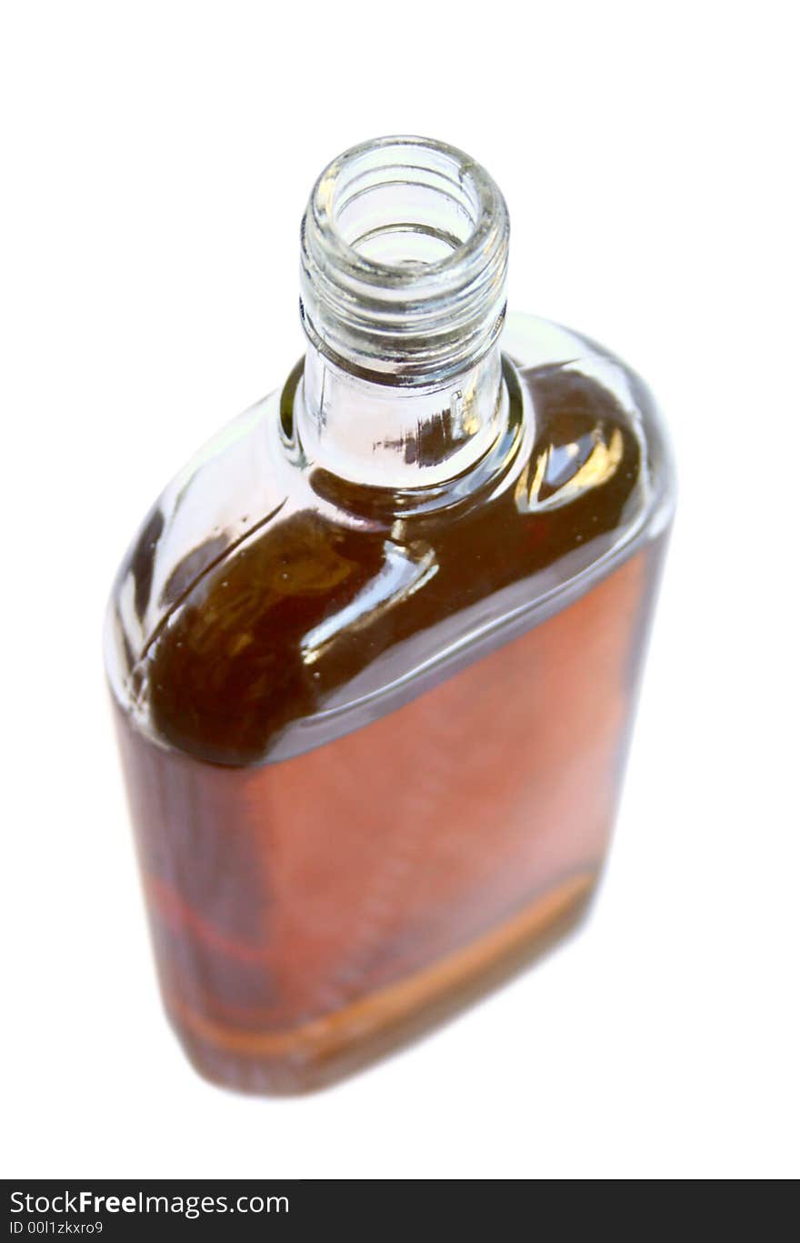 The open bottle with an alcoholic drink