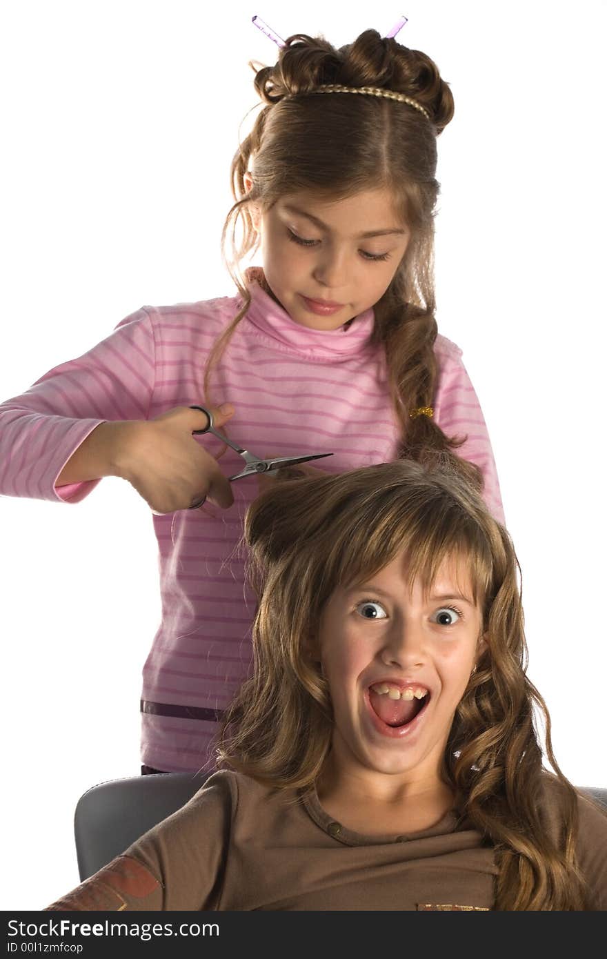 Girl-friends play a hairdressing salon, white background