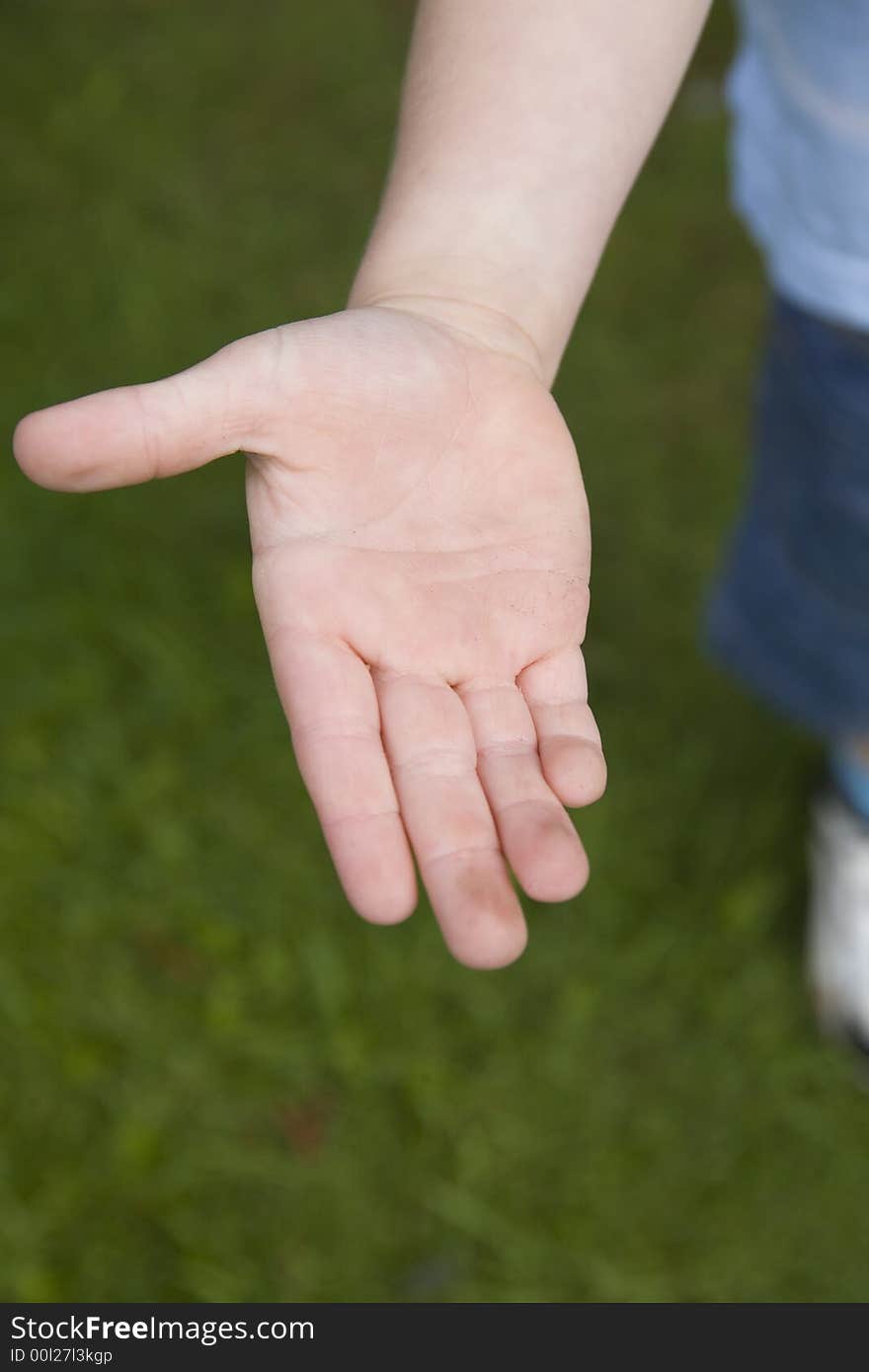 Boy holding out his hand