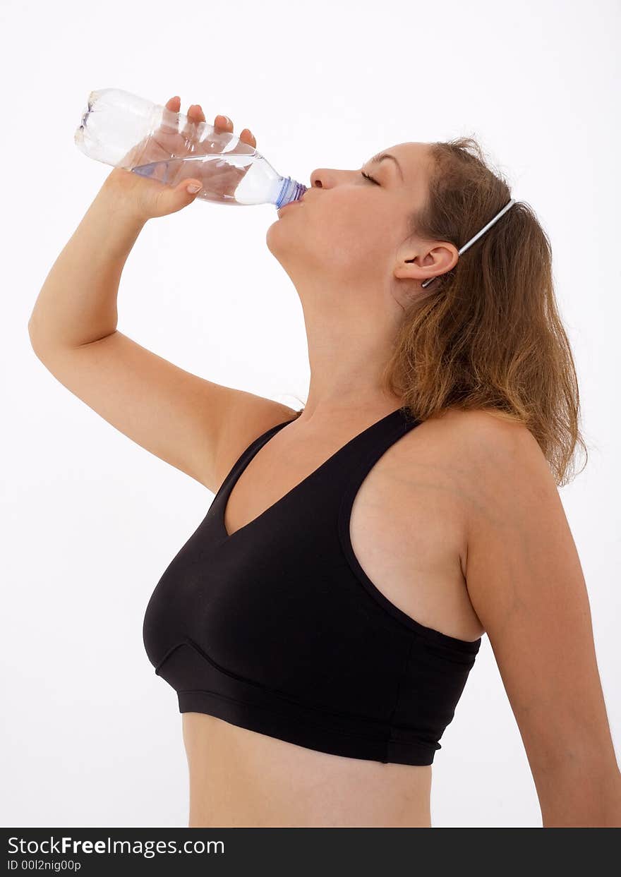 Fitness girl drinking water, isolated