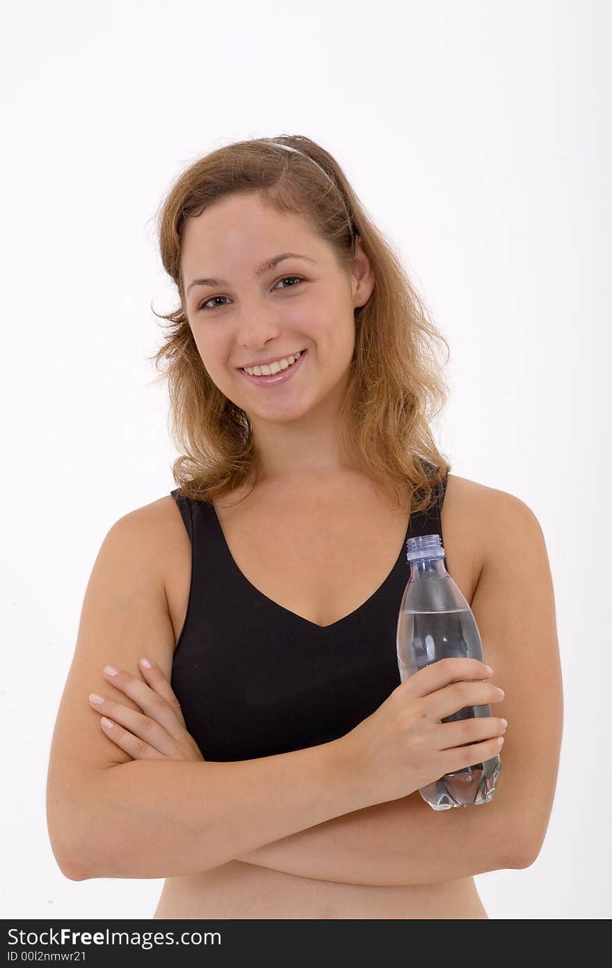 Fitness girl holding a bottle of water. Fitness girl holding a bottle of water