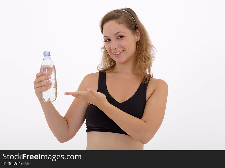 Fitness girl holding a bottle of water. Fitness girl holding a bottle of water