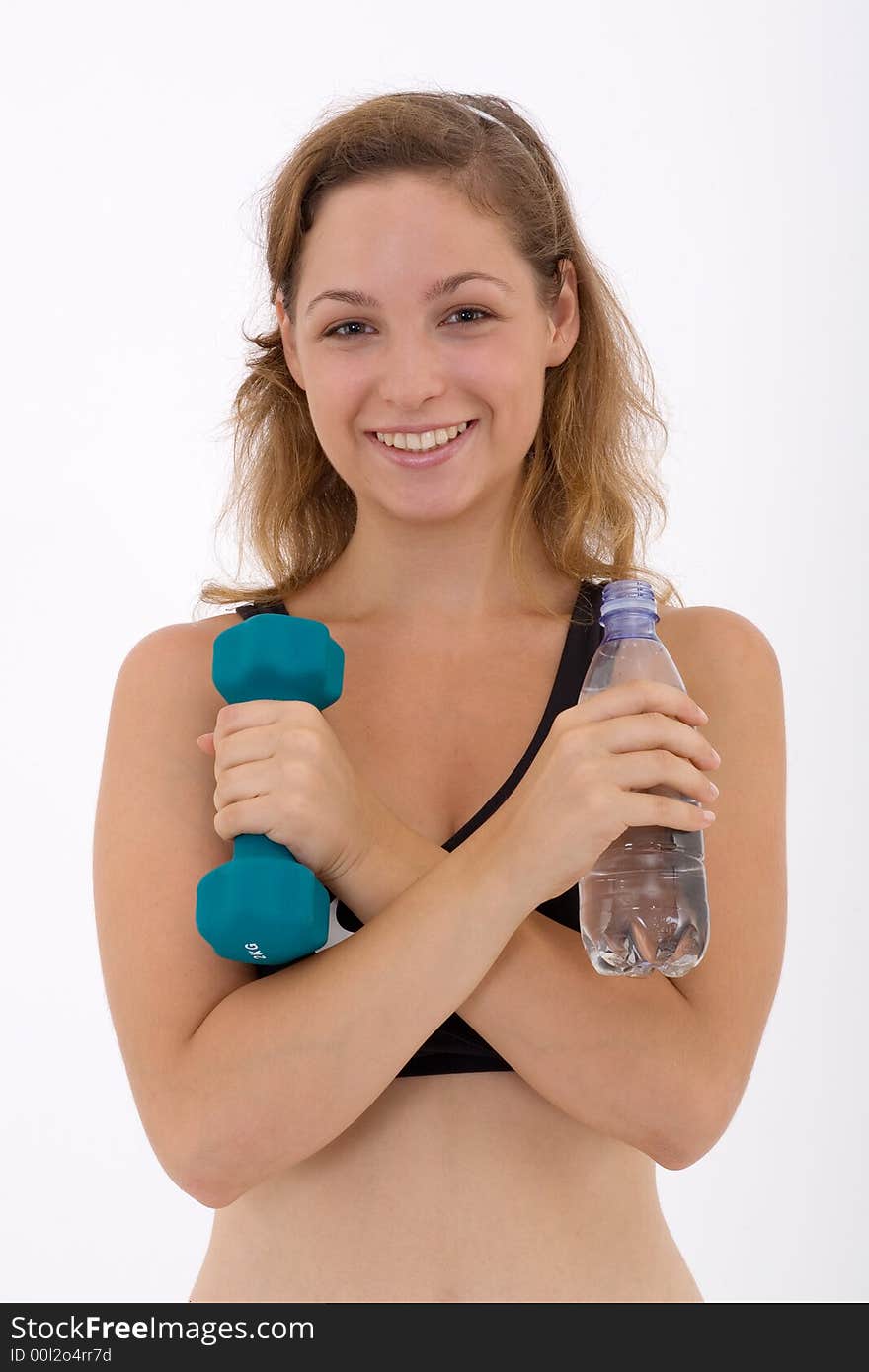 Fitness girl holding a bottle of water and a weight. Fitness girl holding a bottle of water and a weight