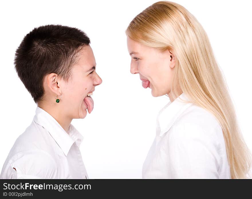 Close-cut brunette and long-haired blond stand face to face and to stick each other tongues out. Close-cut brunette and long-haired blond stand face to face and to stick each other tongues out.