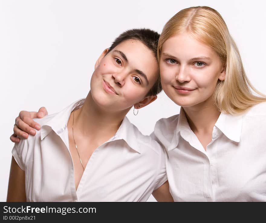 Portrait of two beautiful girls on white background