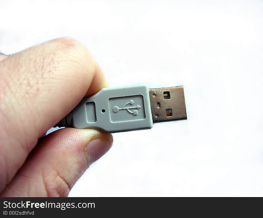 Connetion: hand and a USB cable. Connetion: hand and a USB cable