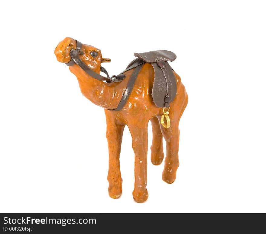 Camel toy with saddle isolated on white