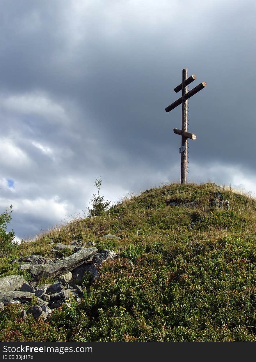 Tall metal cross stands on the hill. Tall metal cross stands on the hill