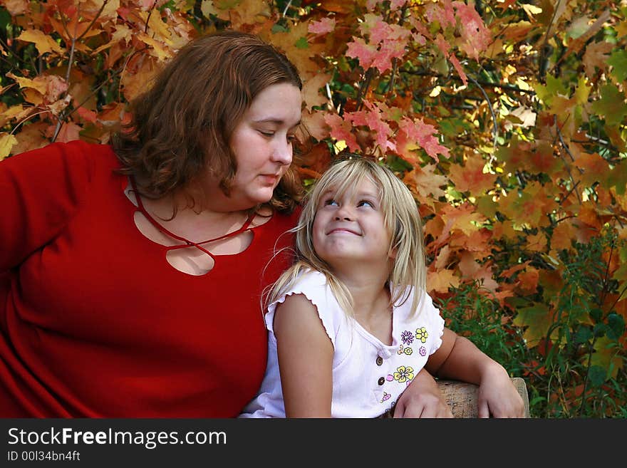 Beautiful large woman in red with her young daughter. Beautiful large woman in red with her young daughter.