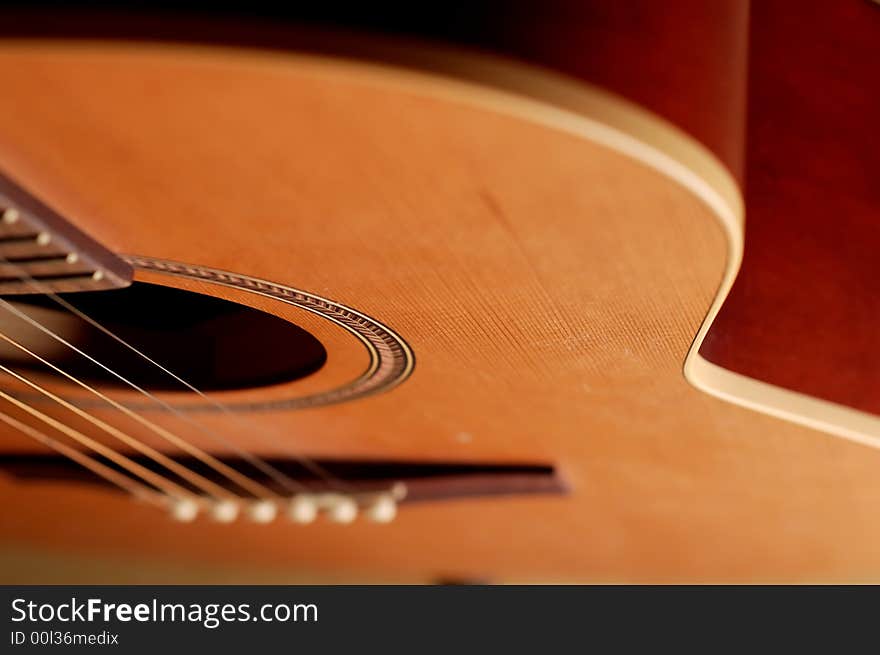 Closeup details of an acoustic wooden guitar