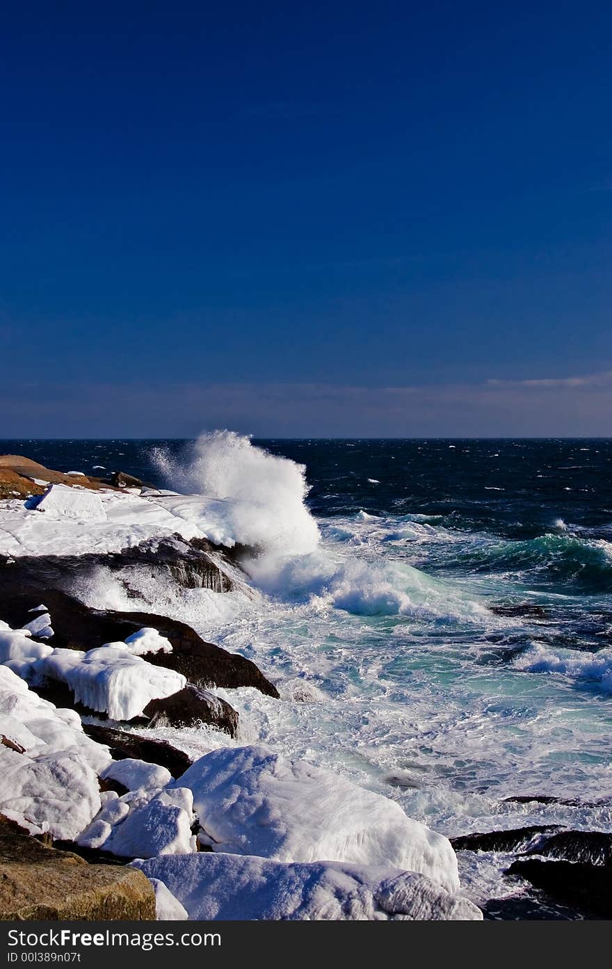 Icy Atlantic coast with waves crashing