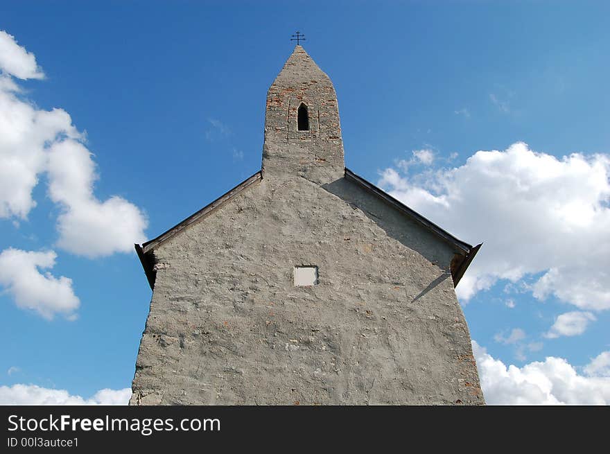 Ancient little church touching clouds in heaven. Ancient little church touching clouds in heaven