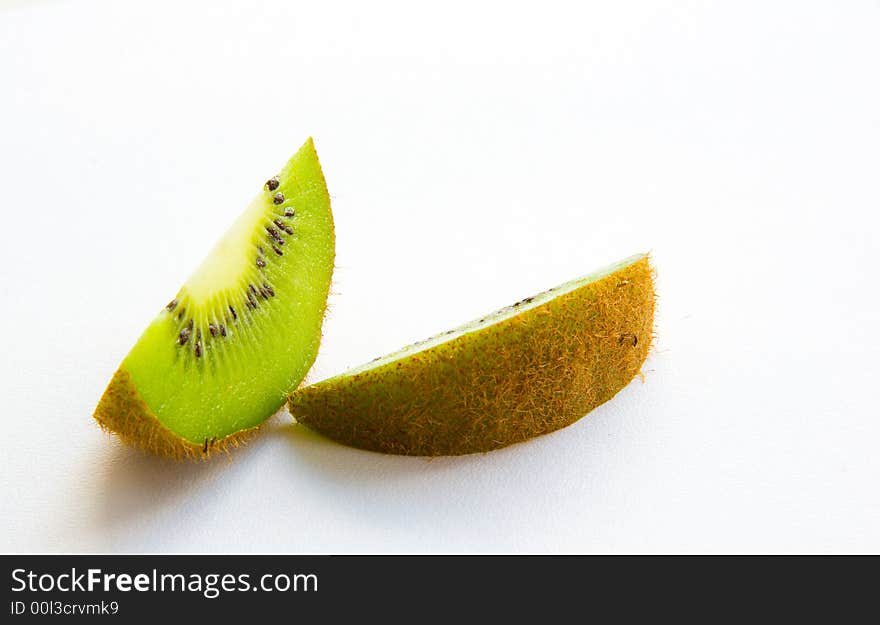 Kiwi pieces on white background. Kiwi pieces on white background