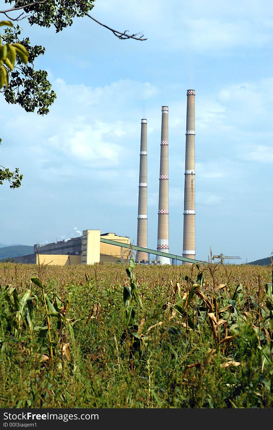 A factory in a middle of a field