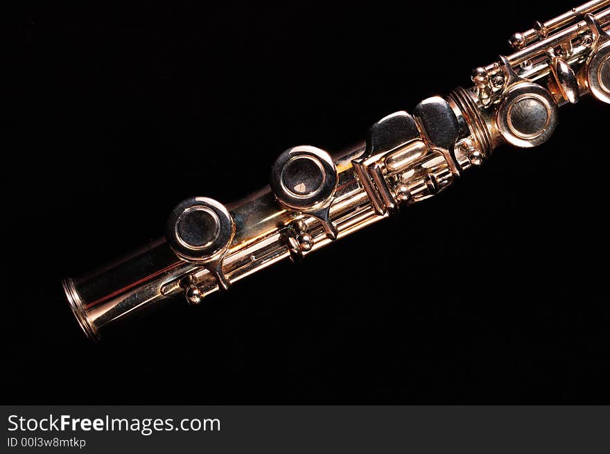 Detail of a Western concert flute, black background. Detail of a Western concert flute, black background