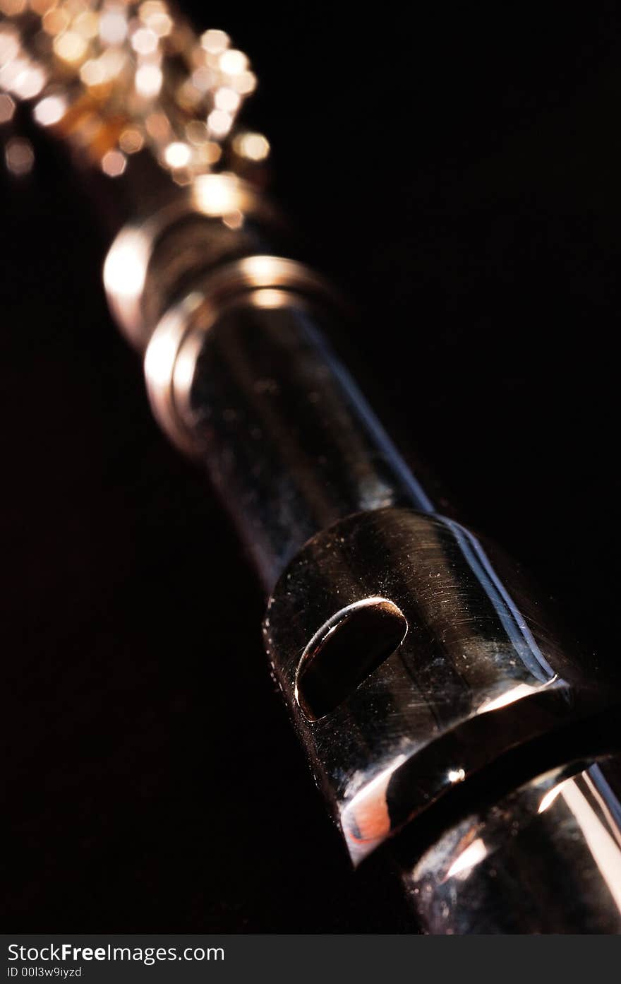 Detail of a Western concert flute, black background. Detail of a Western concert flute, black background