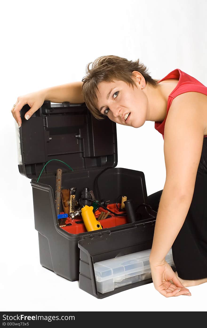 Portrait of young despondent brunette with toolbox. Portrait of young despondent brunette with toolbox