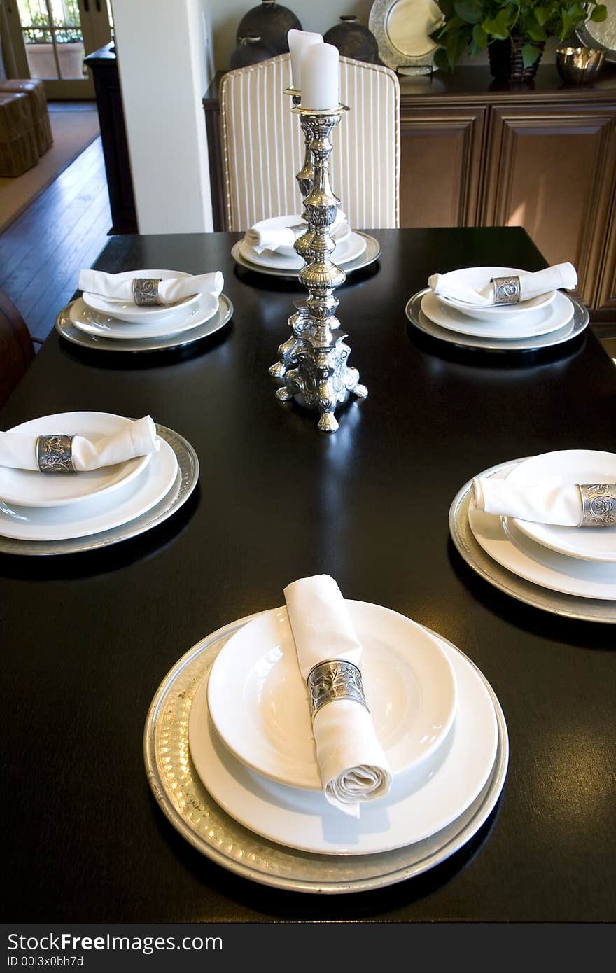 Festive dining table with luxurious dinnerware and decor. Festive dining table with luxurious dinnerware and decor.