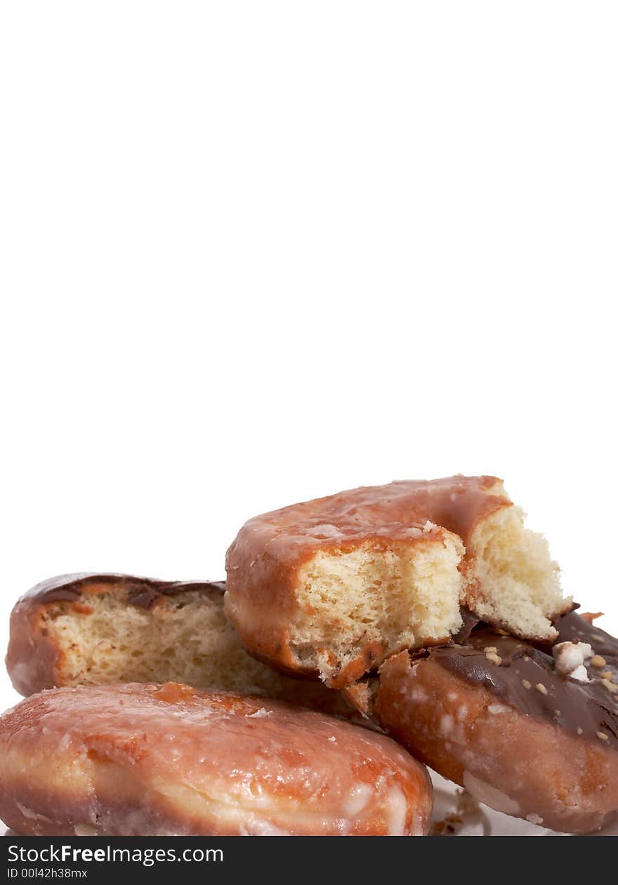 A plate of doughnuts over a white background