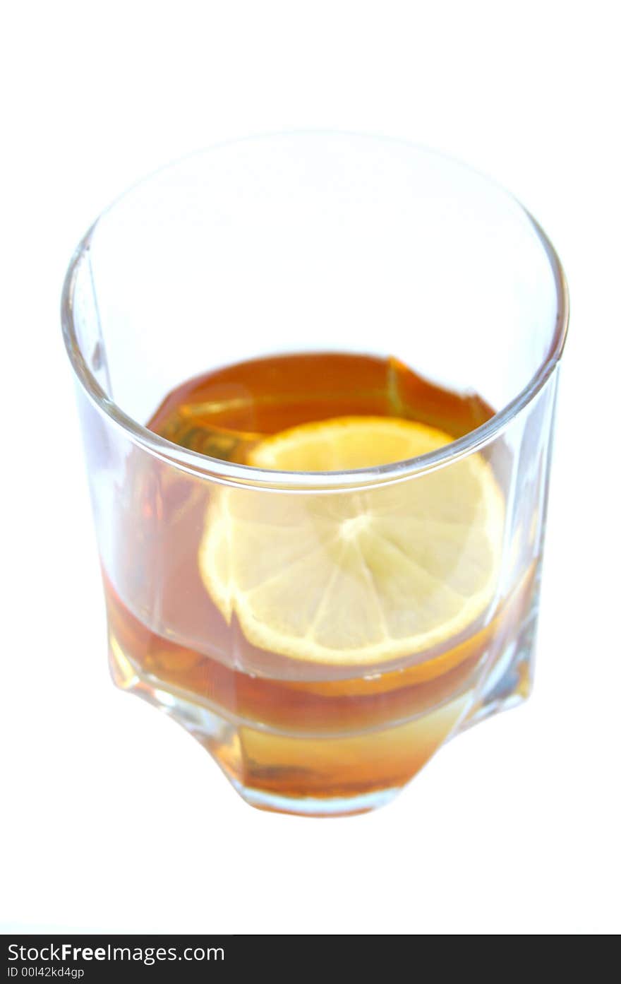 Cognac in a glass, with lemon