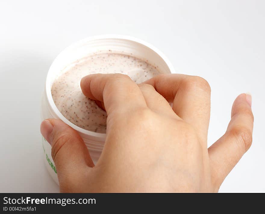 Photo of hands putting lotion over a white background