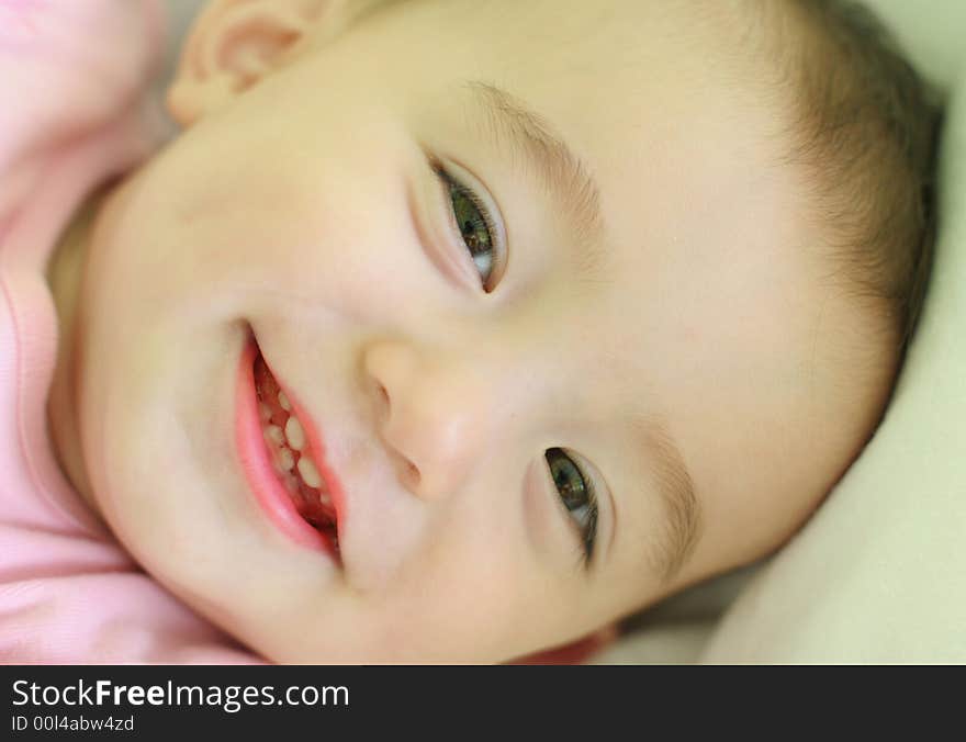 Ten months old baby girl smiling. Ten months old baby girl smiling