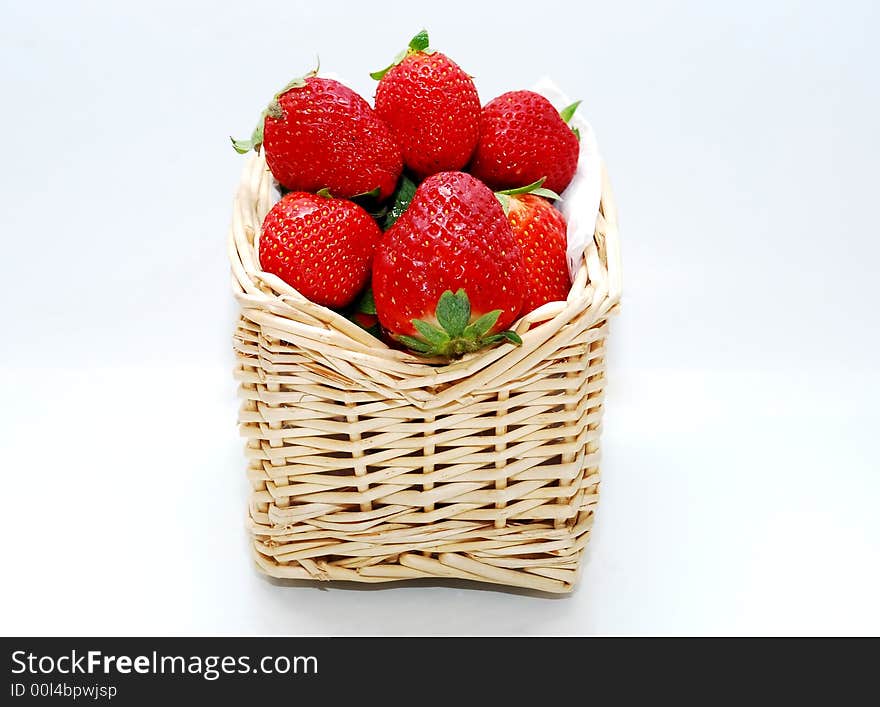 Beautiful focus a strawberry fruits in the wooden baskets. Beautiful focus a strawberry fruits in the wooden baskets